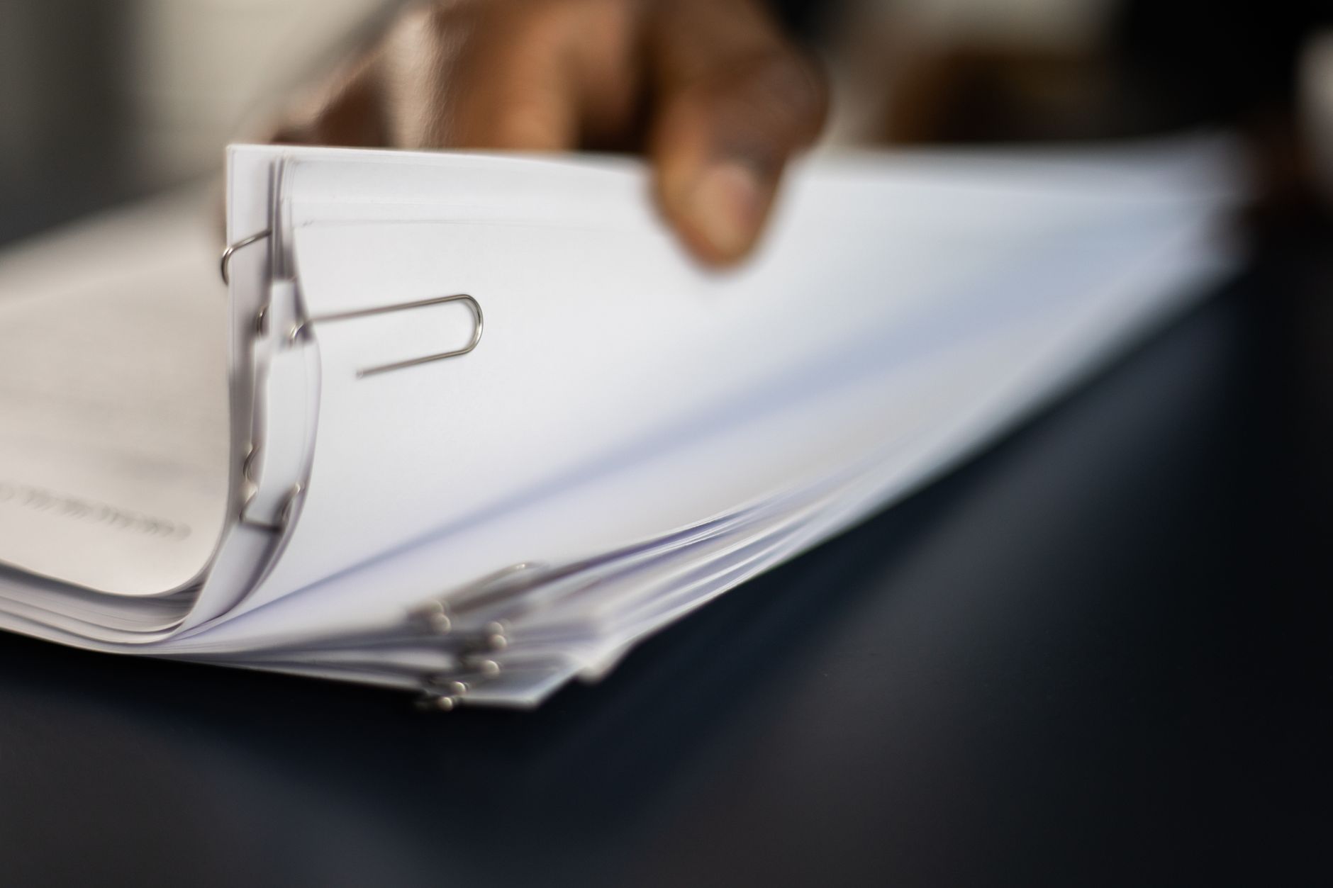 Close view of a clipboard holding papers
